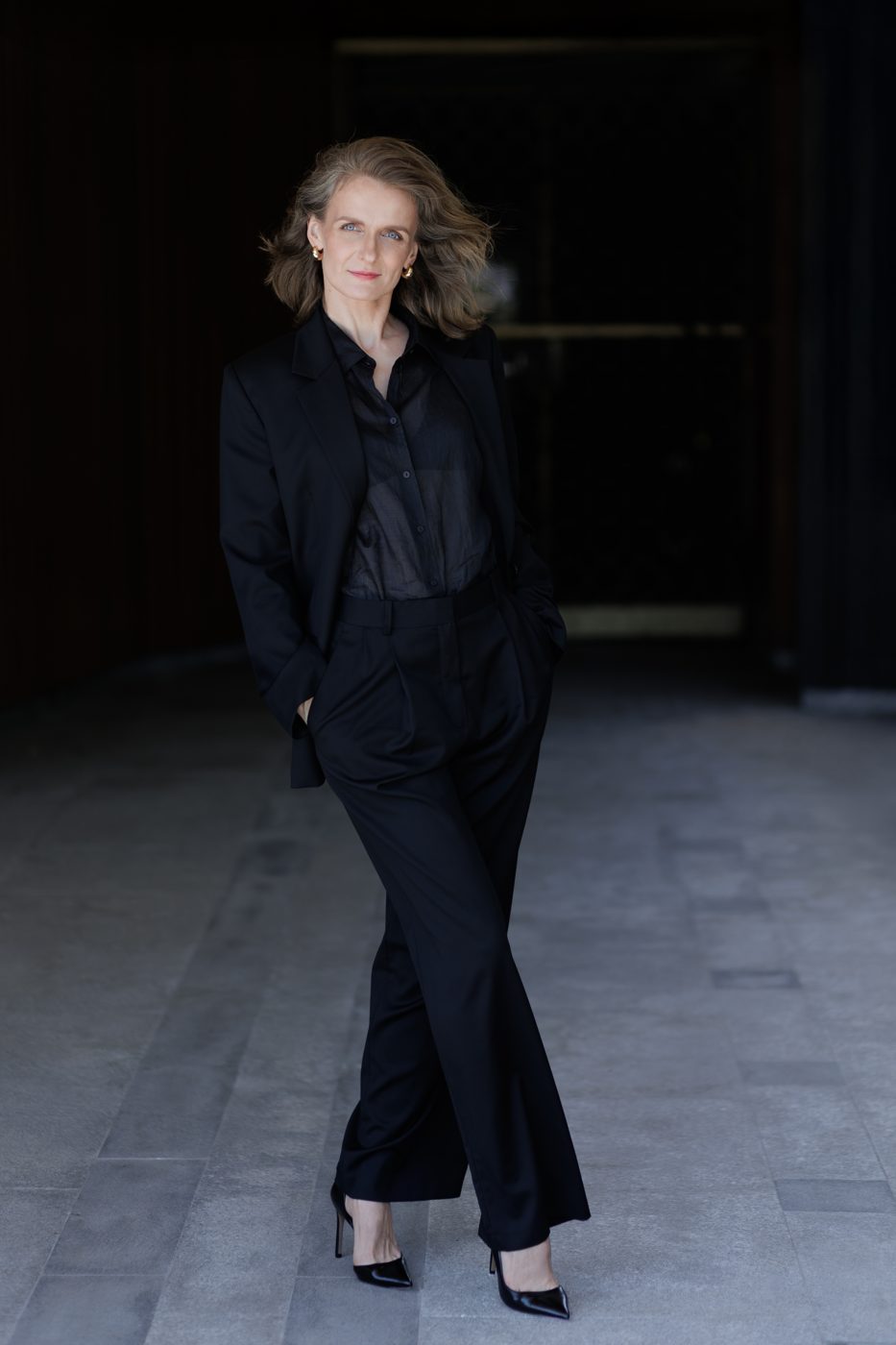 Monika Valkunaite in a black suit